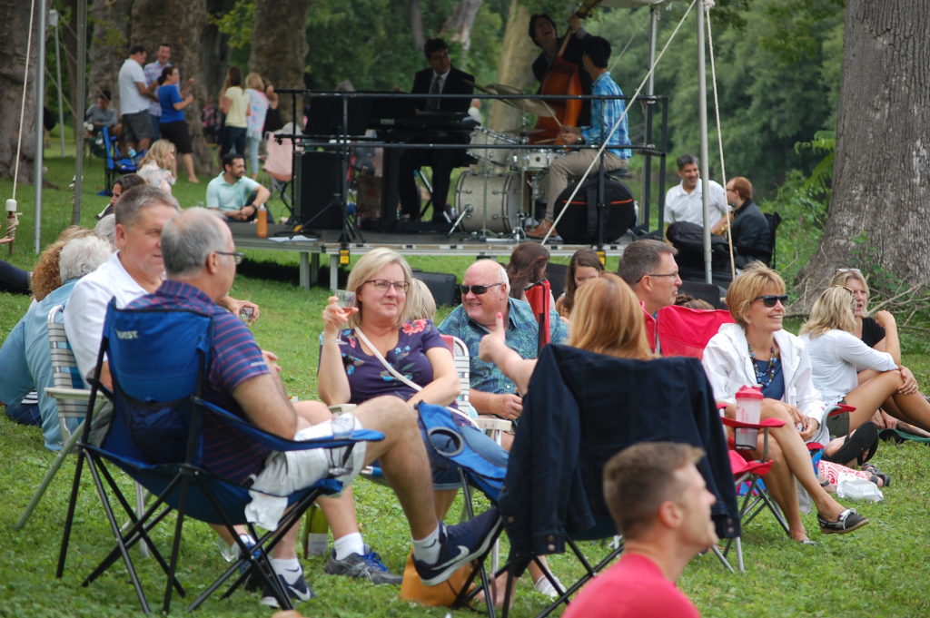 People on the riverbank at Washington Crossing Historic Park
